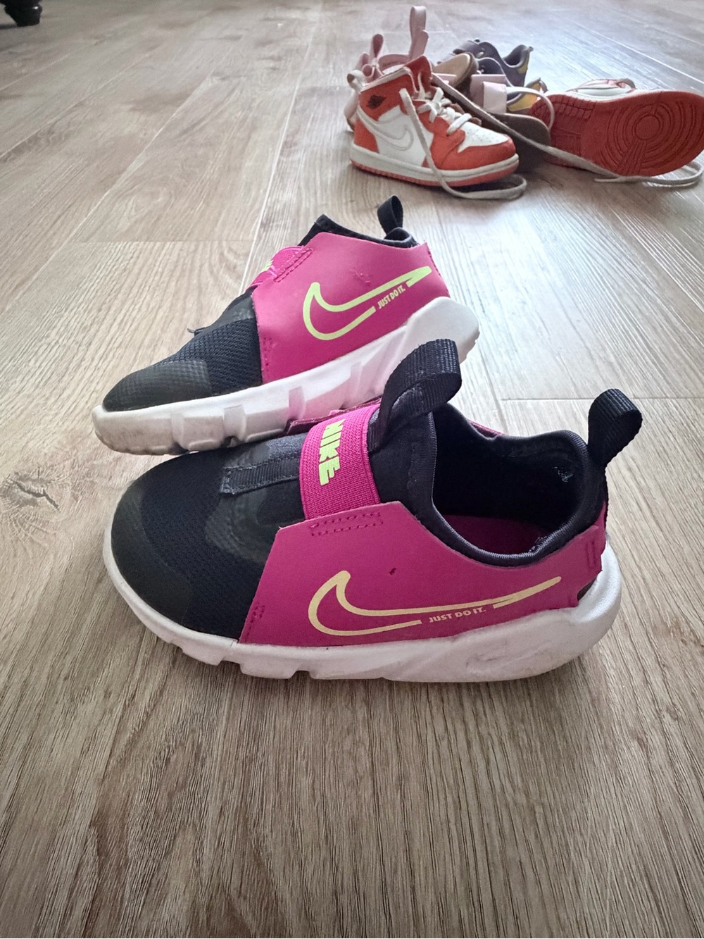 Nike Kids Black & Pink Slip-On Athletic Sneakers with Neon Swoosh